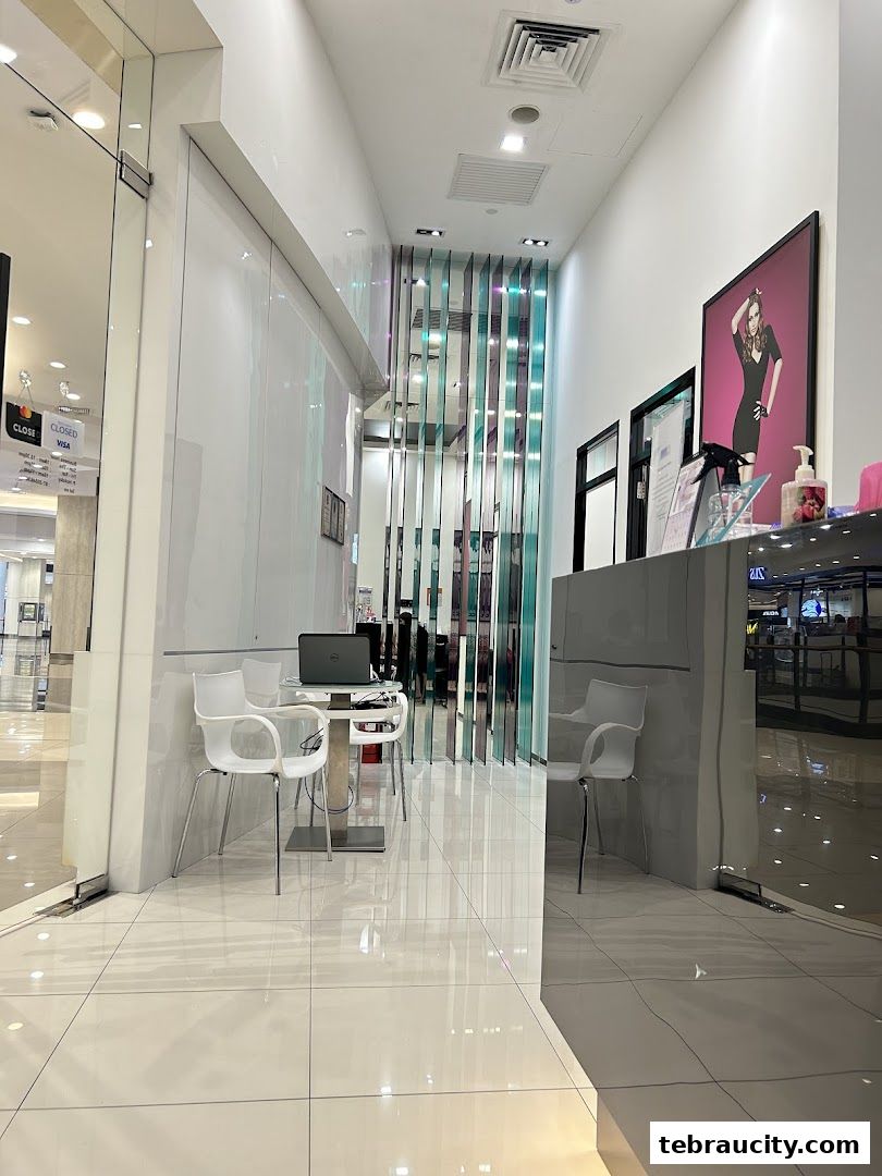 Interior view of a modern slimming salon with a reception desk and seating area.