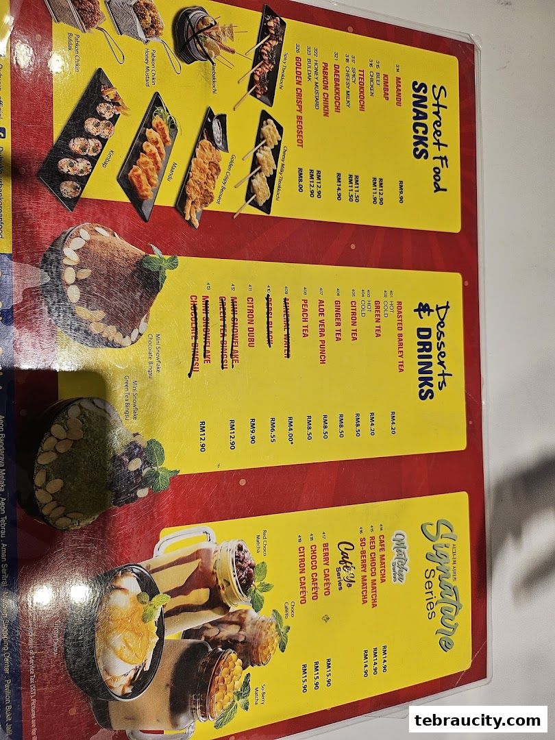 A menu from DubuYo Mini featuring Korean street food snacks, desserts, and drinks.