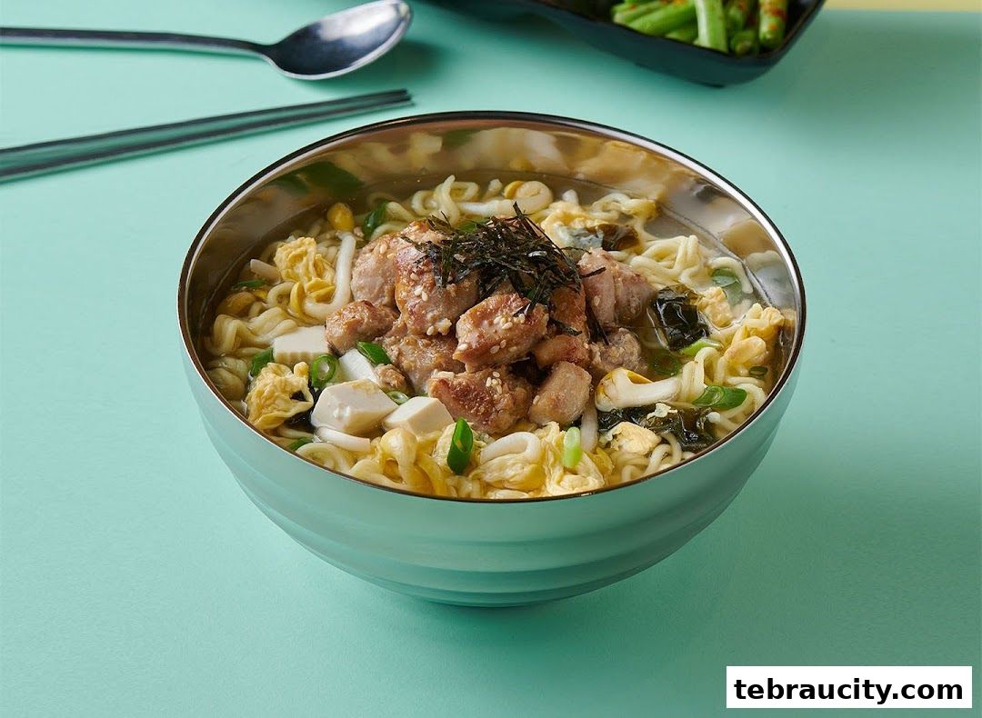 A close-up shot of a steaming bowl of Korean ramen with pork, egg, and seaweed.