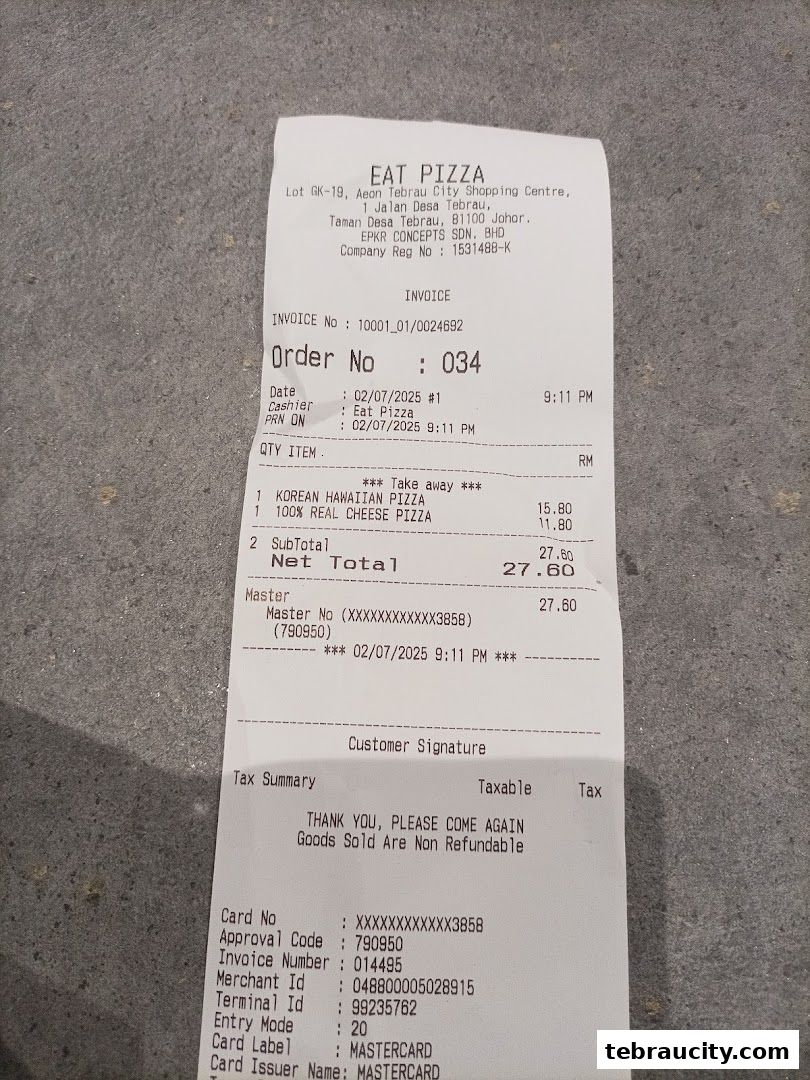 A receipt from Eat Pizza showing two pizza orders and payment details.