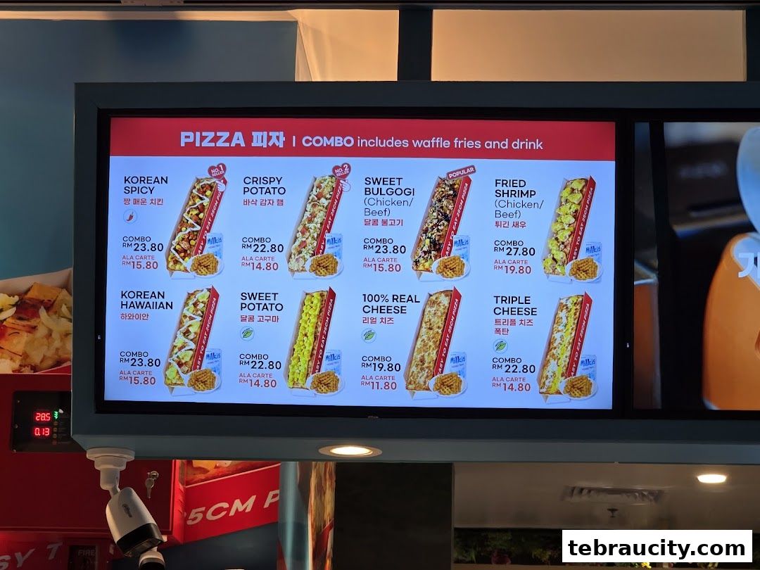 A digital menu board displaying various pizza options with prices and images.