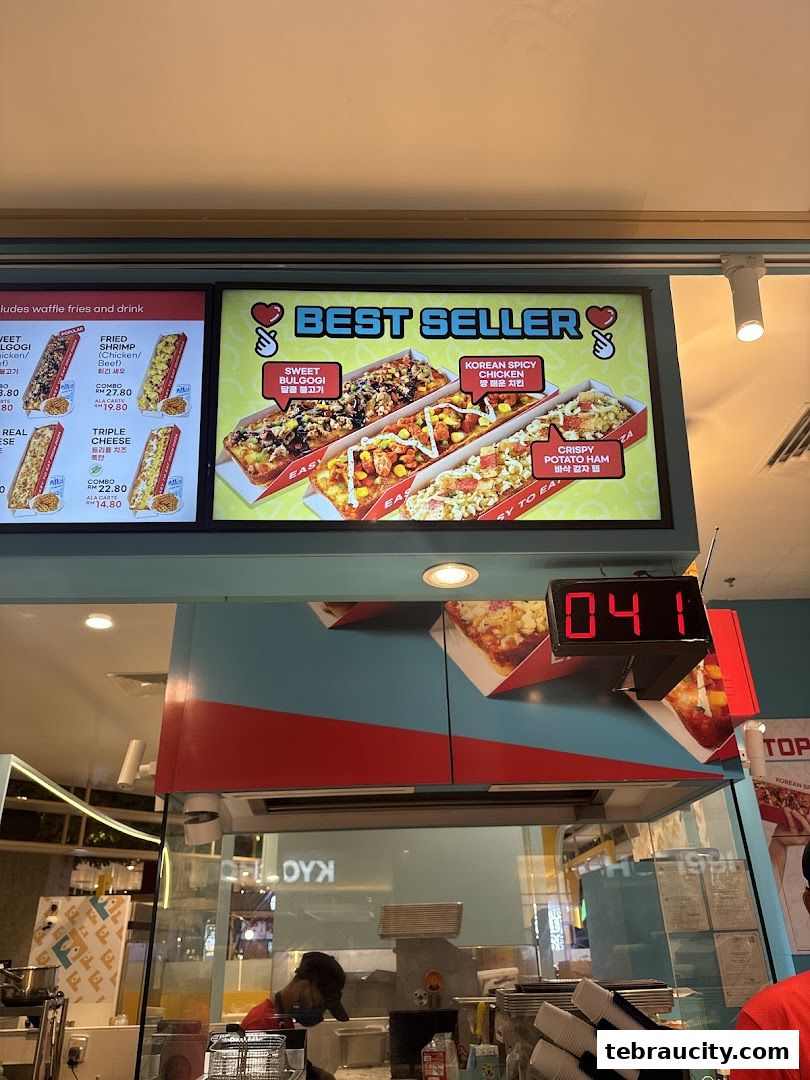 A digital menu board displaying best-selling pizza flavors with enticing images and descriptions.