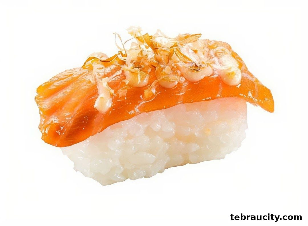 A close-up of a delicious salmon sushi nigiri with sauce and toppings.