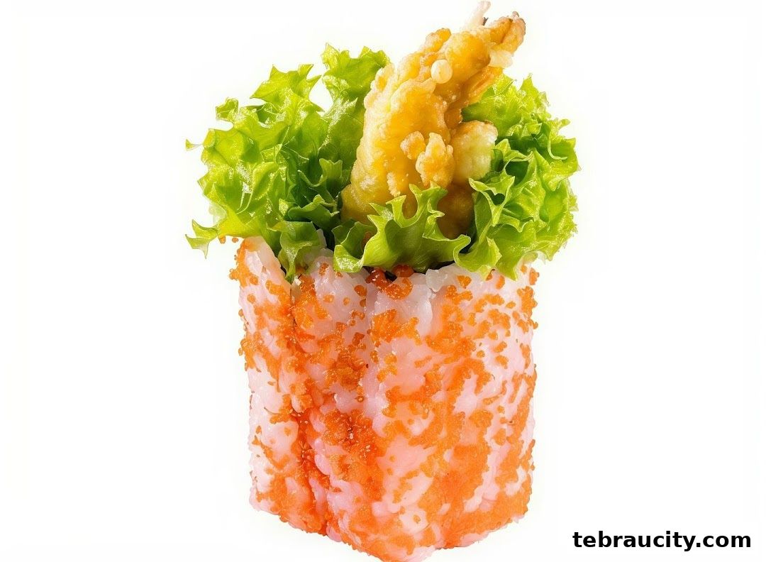 A close-up of a sushi roll with tempura shrimp, lettuce, and tobiko.