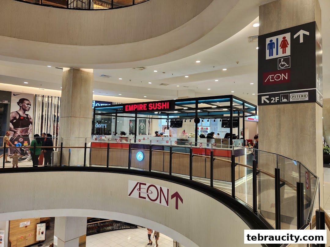 Empire Sushi shop located in a shopping mall with customers and staff visible.