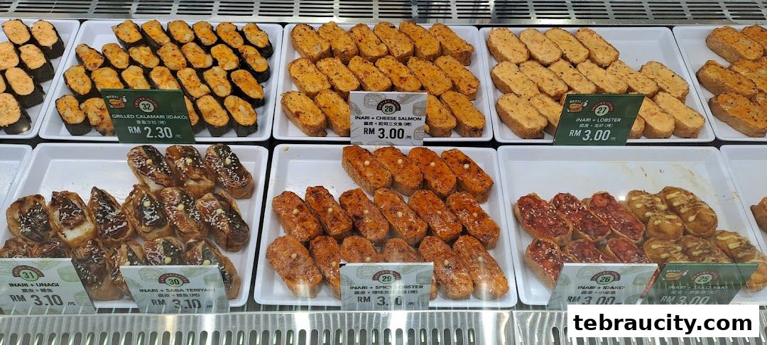 A display of various sushi and inari items with price labels.