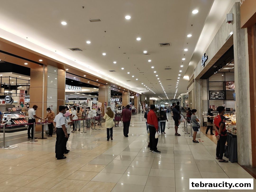 People queuing outside a Famous Amos store in a shopping mall.