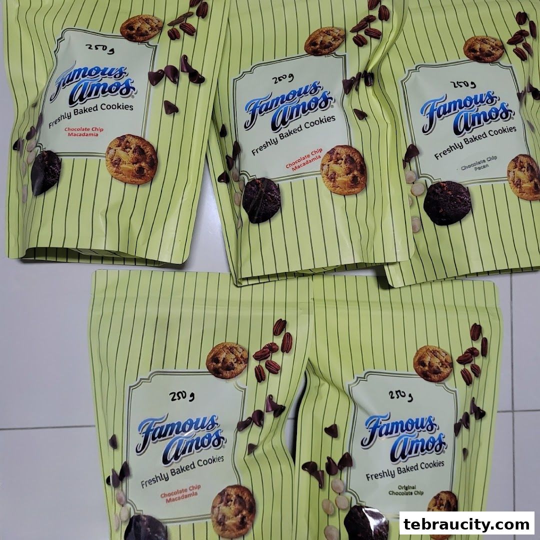 Several bags of Famous Amos cookies with chocolate chip and macadamia flavors.