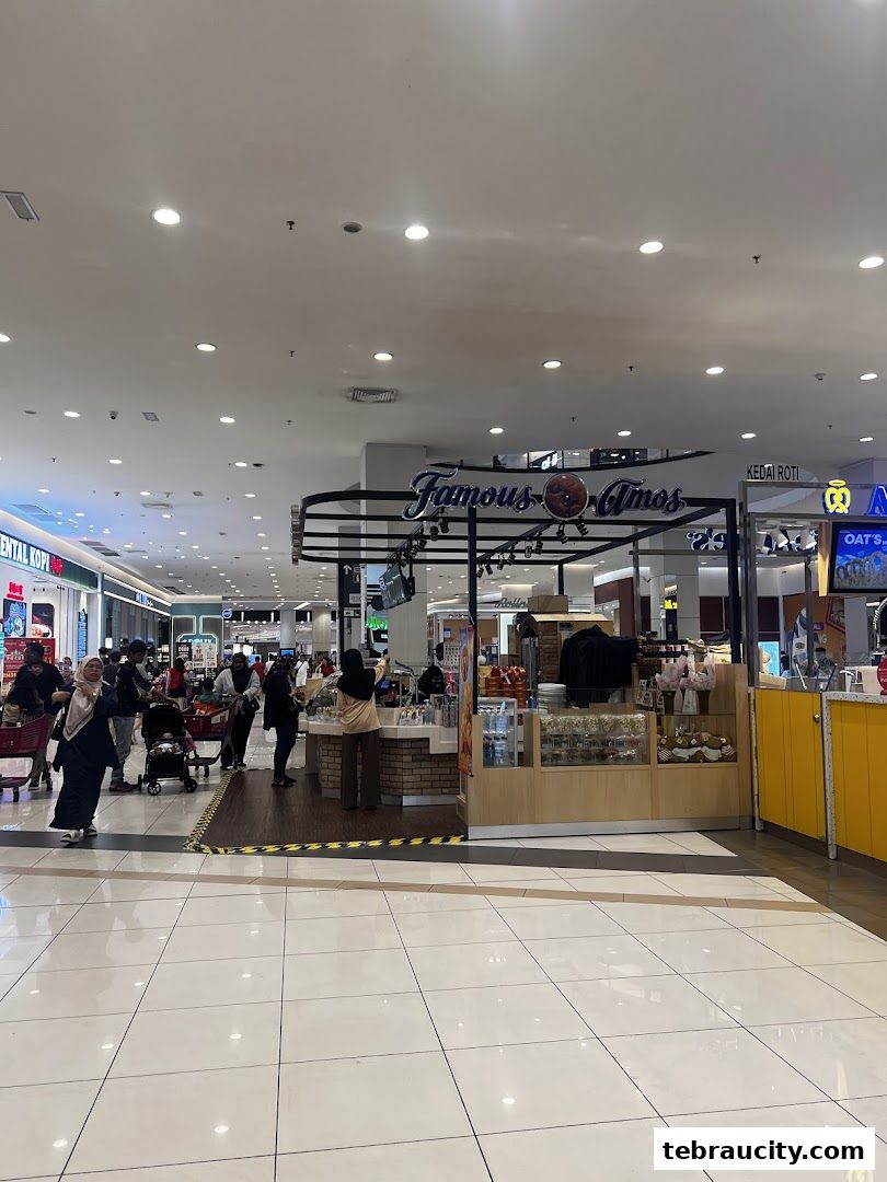 Famous Amos cookie shop counter with various cookies and treats displayed.