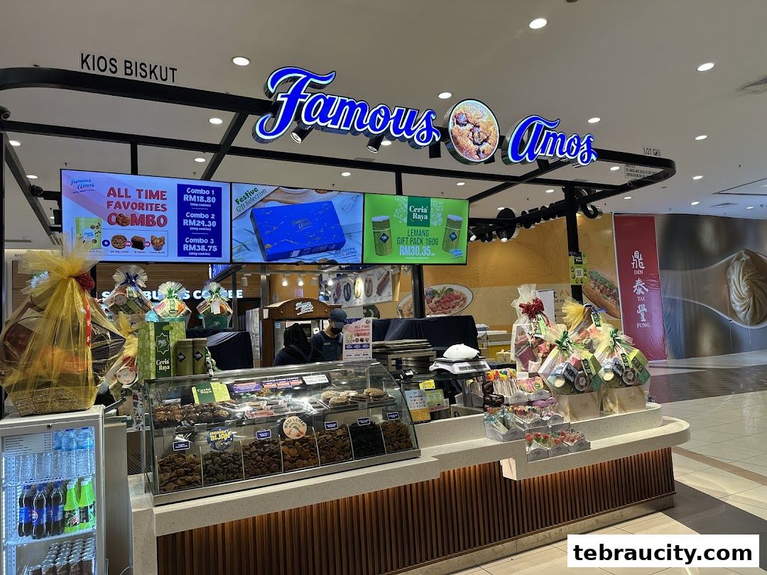 Famous Amos cookie kiosk with various gift baskets and promotional displays.