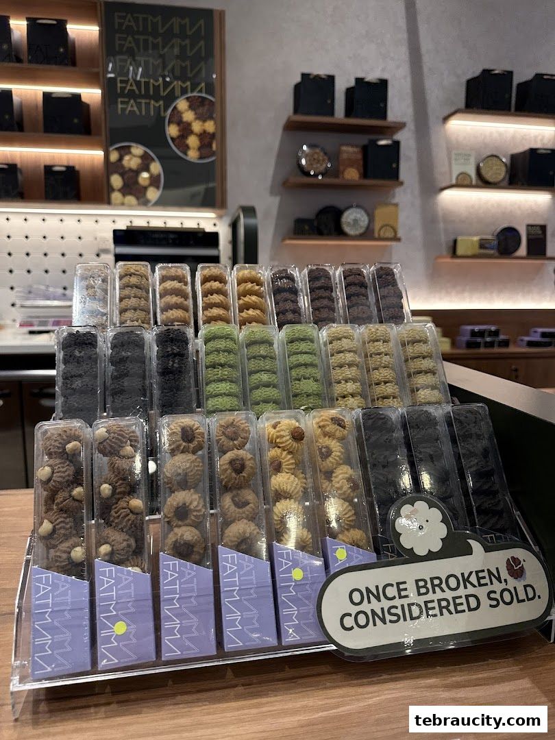 A display of assorted cookies in clear plastic packaging at Fatmama Bakery.