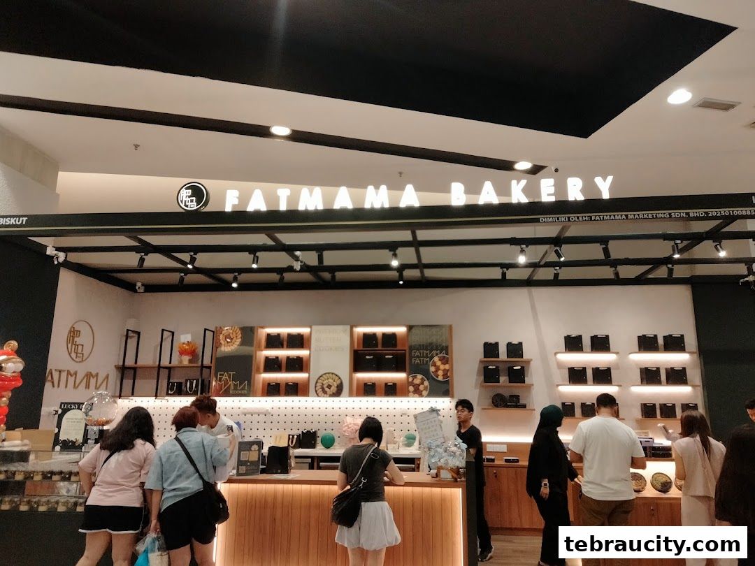 Customers are at the counter of Fatmama Bakery, with products displayed on shelves behind.