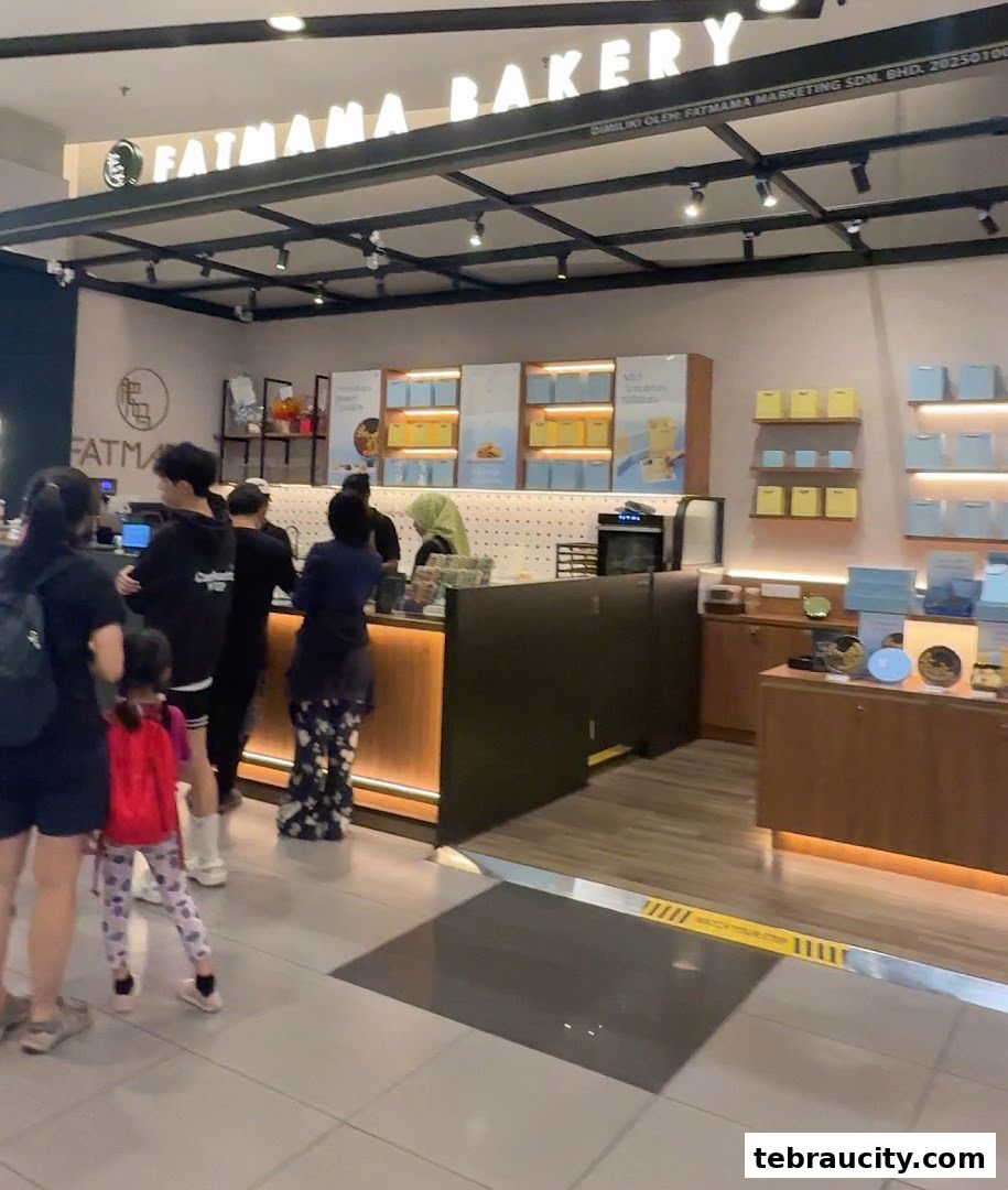 Customers queue at the counter of Fatmama Bakery, with products displayed on shelves.