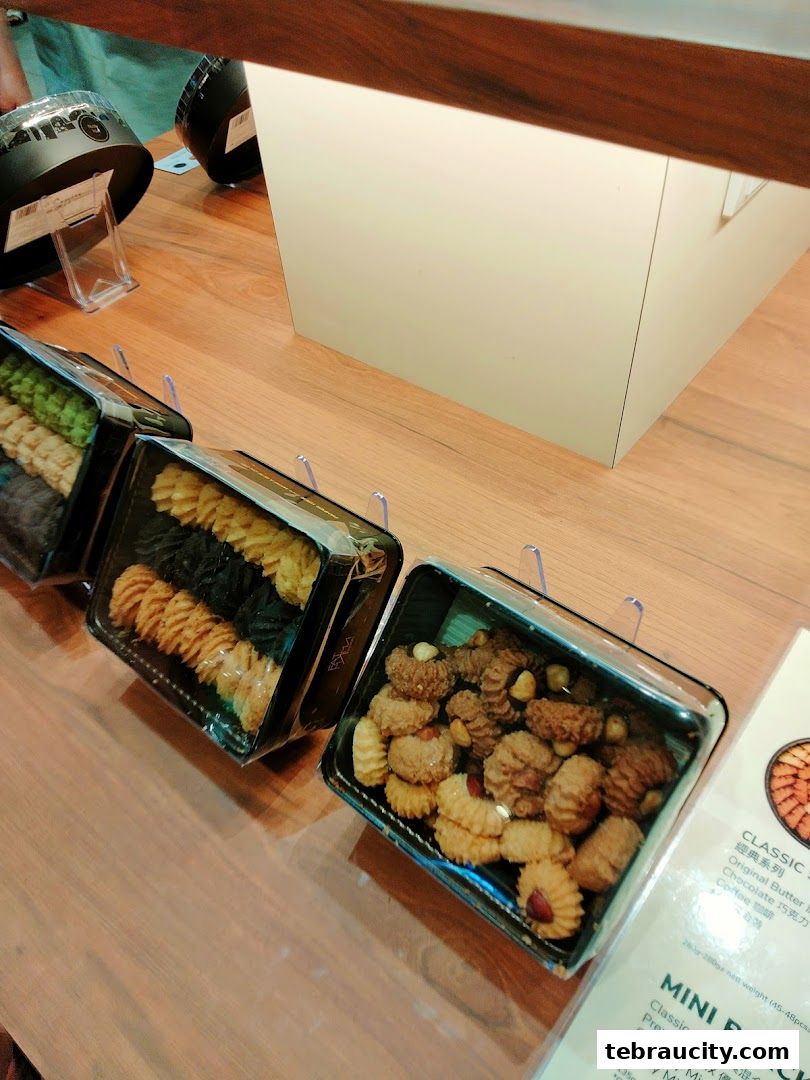 Assortment of packaged cookies displayed on a wooden counter at Fatmama Bakery.