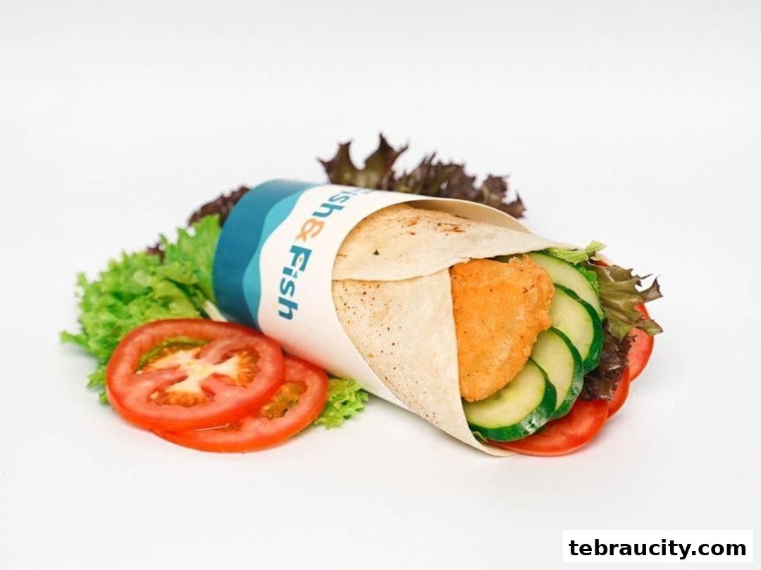A delicious fish wrap with fresh vegetables and a branded wrapper from Fish & Fish.