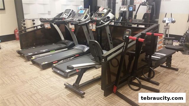 Various treadmills and exercise equipment displayed in a fitness store.