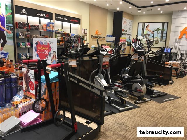 Interior view of a fitness equipment store showcasing various exercise machines and accessories.