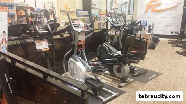 Interior view of a fitness equipment store with treadmills and exercise bikes.