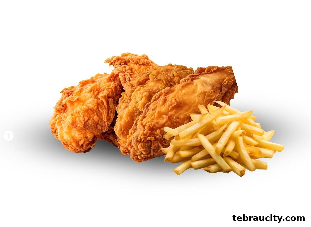 Crispy fried chicken pieces served with a side of golden french fries.