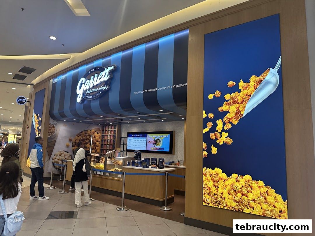 The exterior of a Garrett Popcorn Shops store with customers queuing.