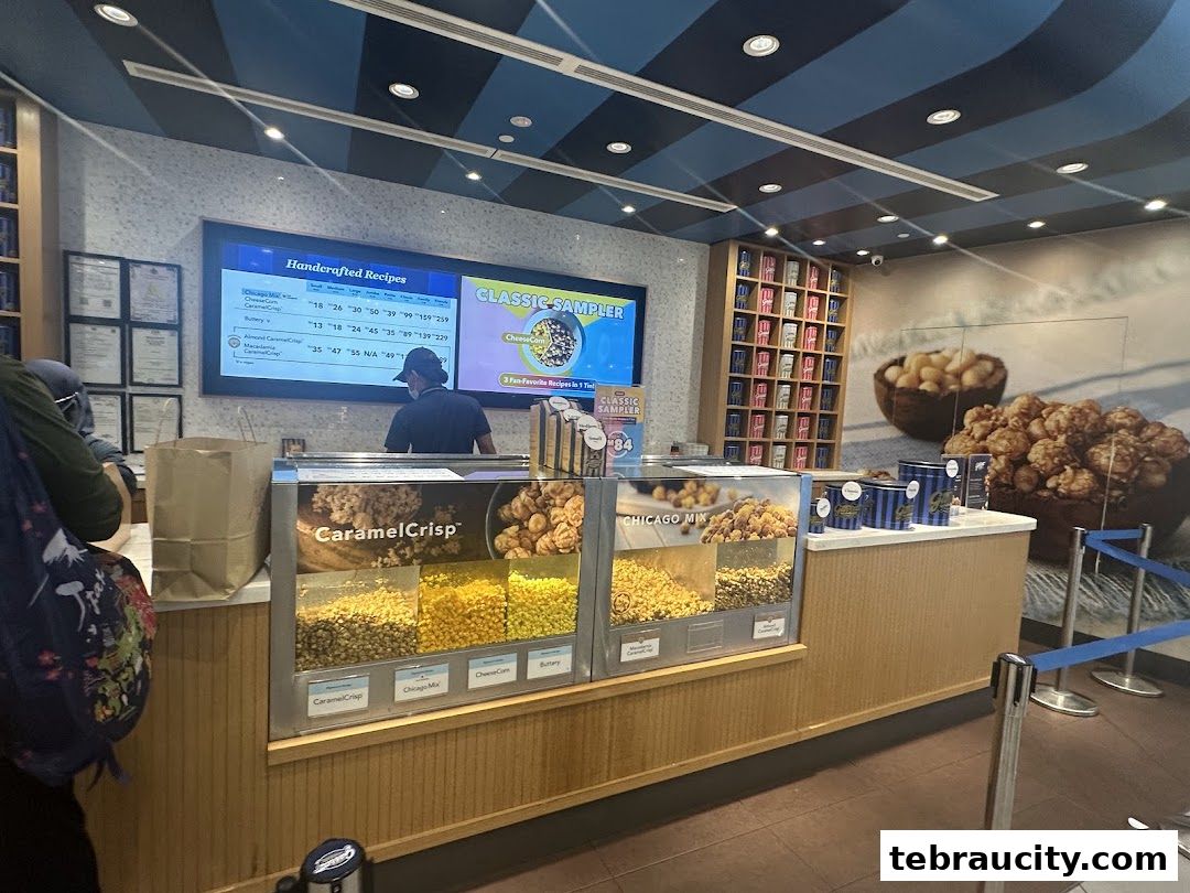 A view of the Garrett Popcorn Shops counter with various popcorn flavors displayed.