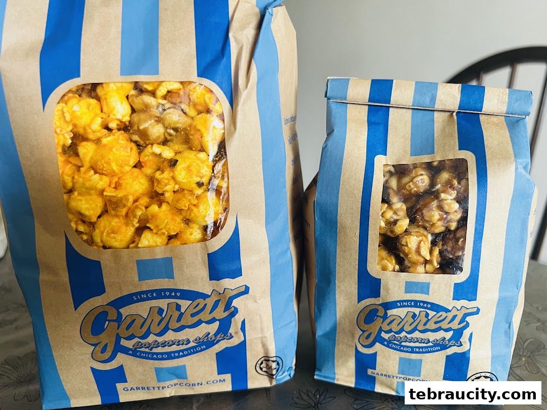 Two bags of Garrett Popcorn Shops popcorn, one with cheese flavor and the other with caramel.