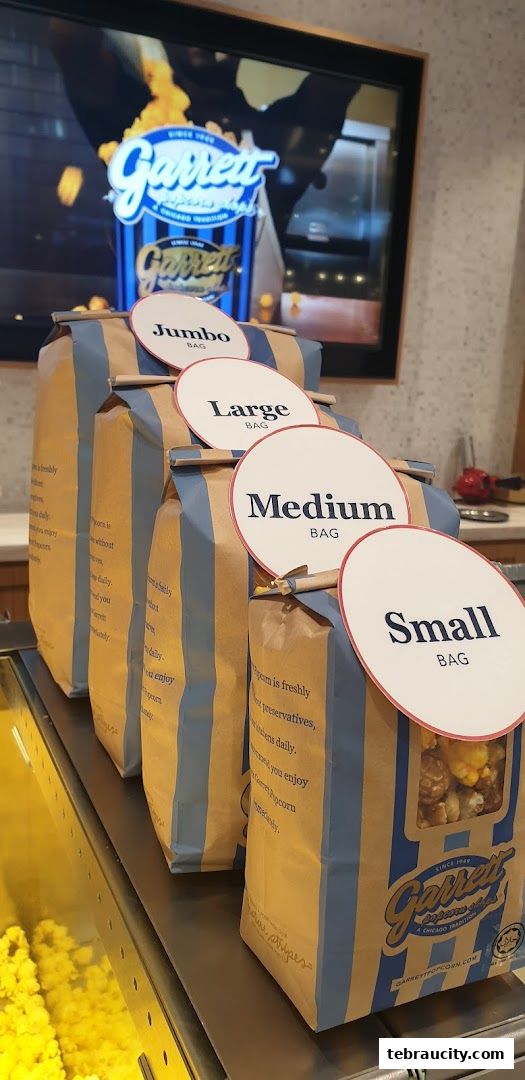 Garrett Popcorn Shops display with bags labeled Small, Medium, Large, and Jumbo.