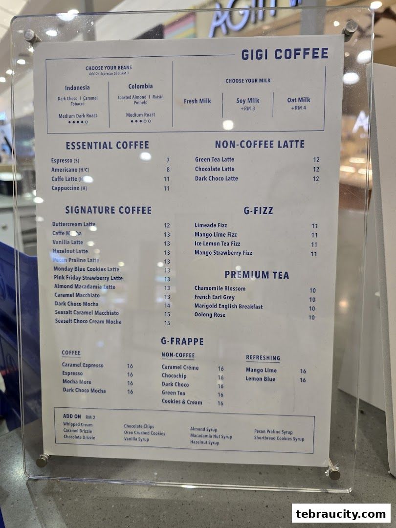 A menu board for Gigi Coffee featuring various coffee, latte, tea, and frappe options.