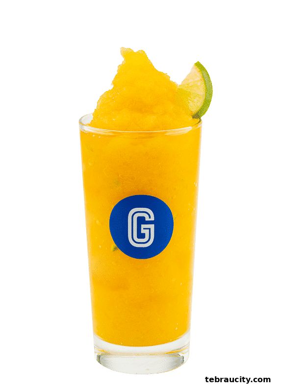 A tall glass of bright orange slushy with a lime wedge garnish and a Gigi Coffee logo.