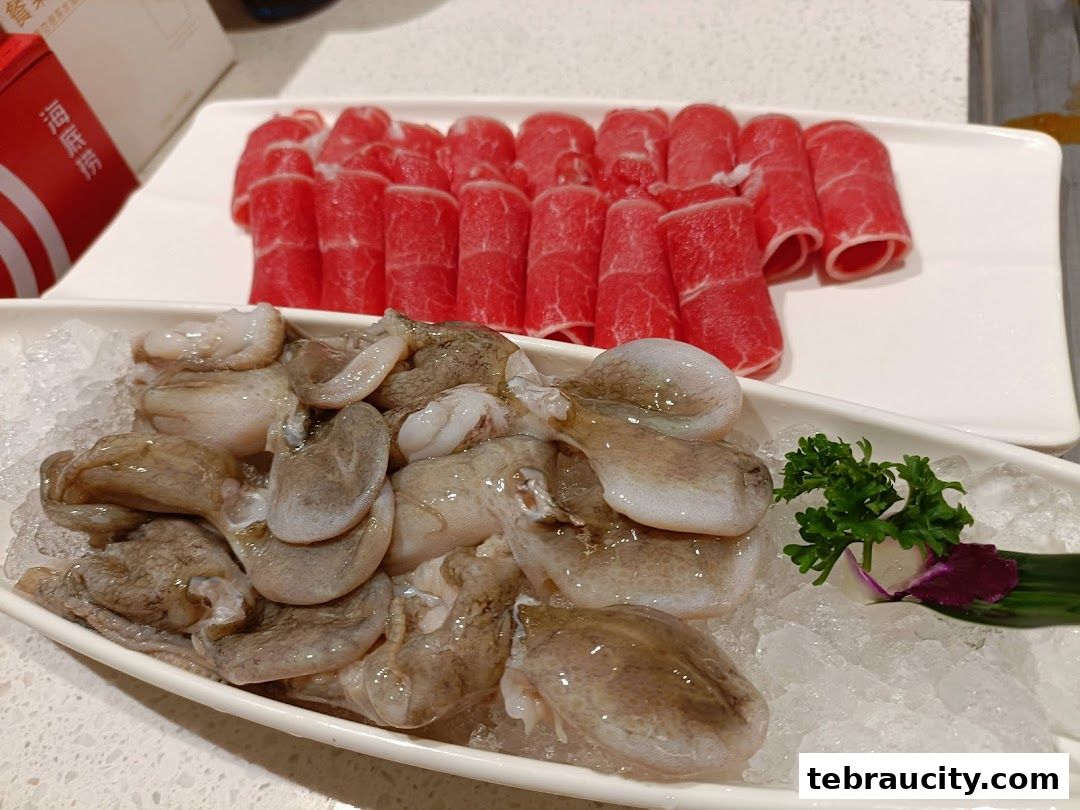 Fresh octopus and thinly sliced beef for hot pot dining.
