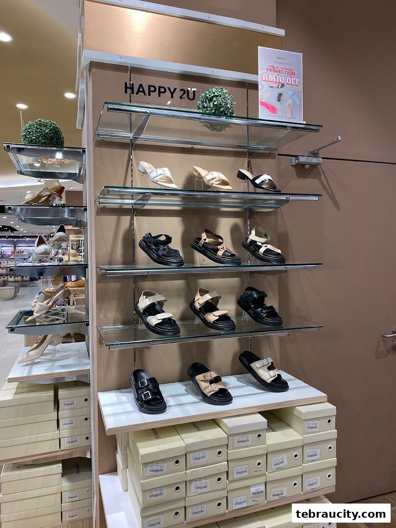 A display of various stylish sandals and shoes at HAPPY2U Tebrau City.