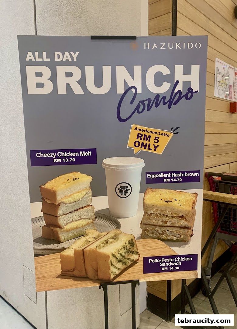 A sign advertising Hazu Bakery Cafe's All Day Brunch Combos with sandwiches and drinks.