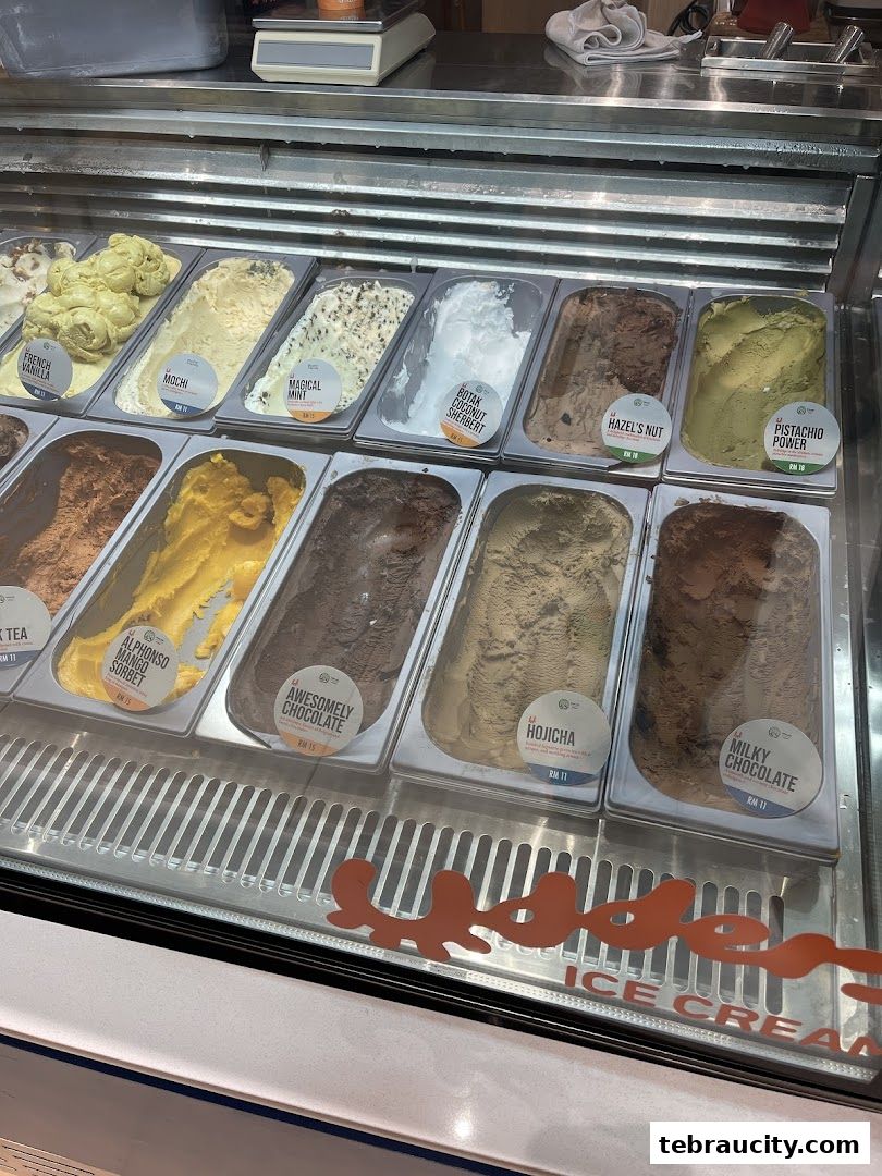 A display case filled with various flavors of ice cream and sorbet.