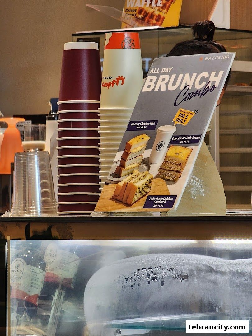 A display board showcasing brunch combos and drinks at Hazu Bakery Cafe.