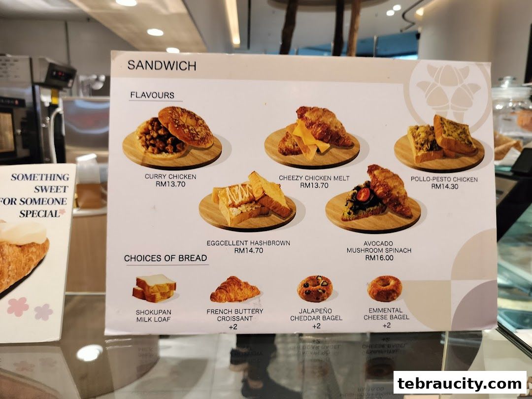 A menu board displaying various sandwich flavors and bread choices with prices.