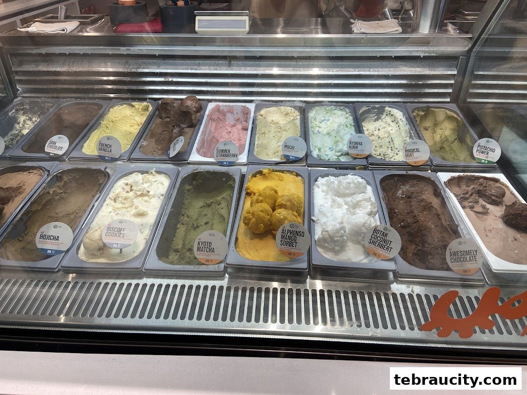 A display case filled with various flavors of ice cream and sorbet.