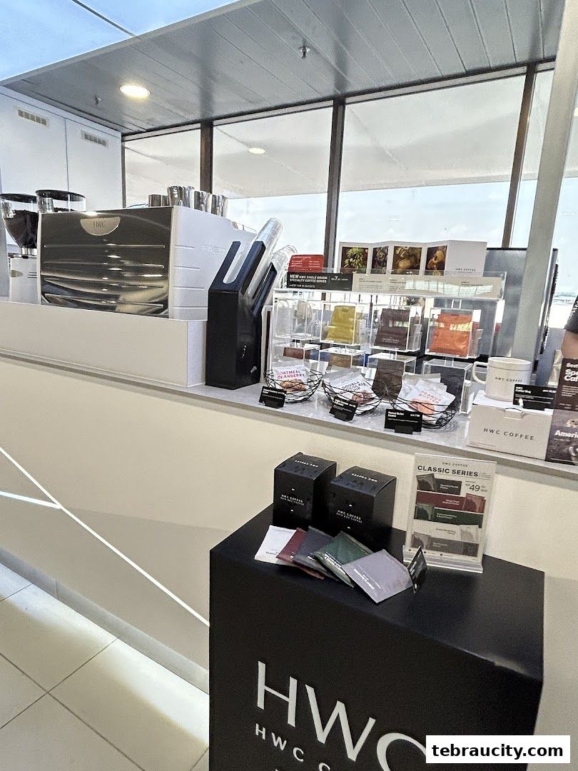 A display of HWC Coffee products and brewing equipment at a counter.