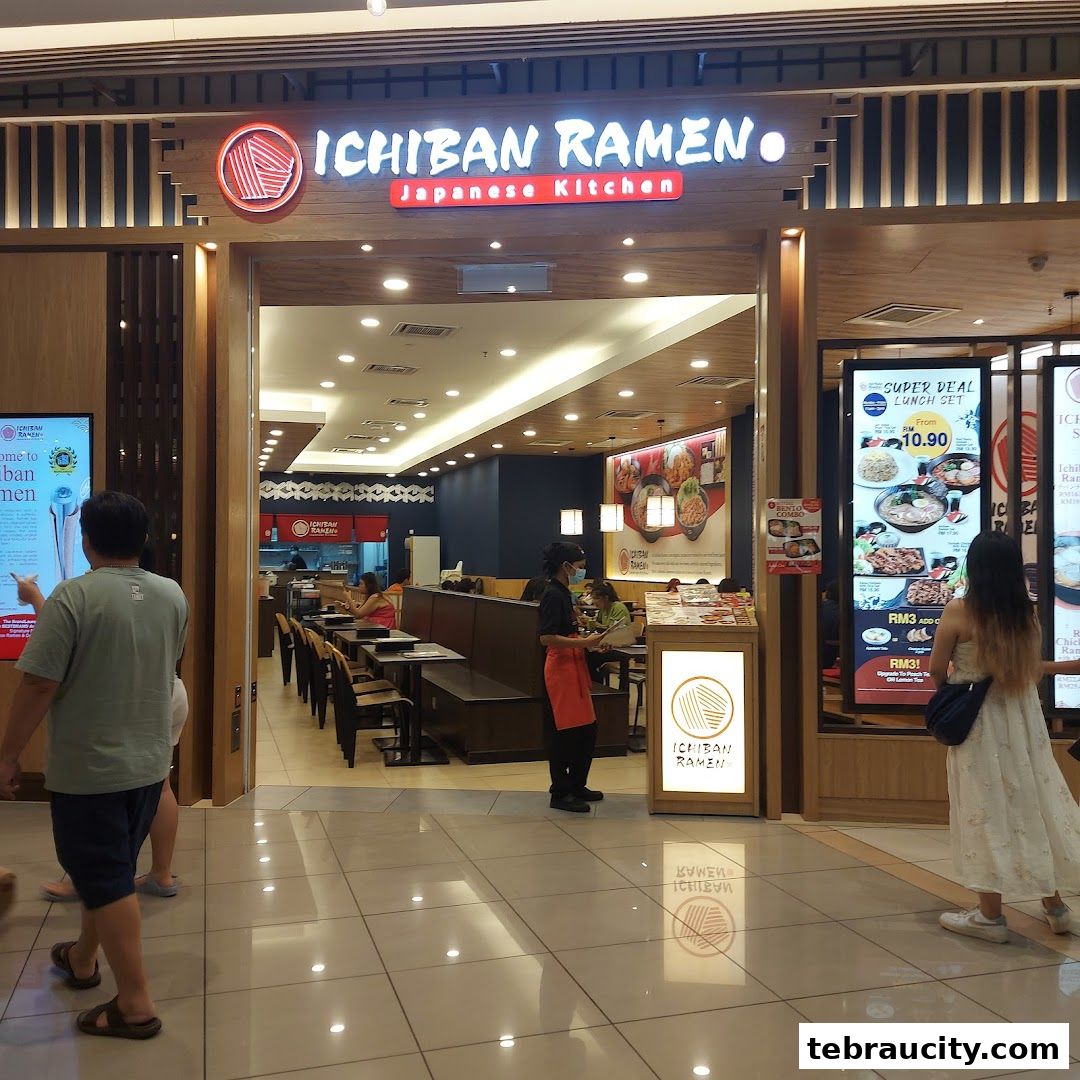 The entrance to Ichiban Ramen, a Japanese kitchen, with customers and staff visible inside.