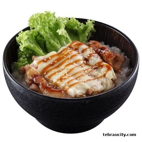 A bowl of rice topped with grilled chicken, melted cheese, sauce, and lettuce.