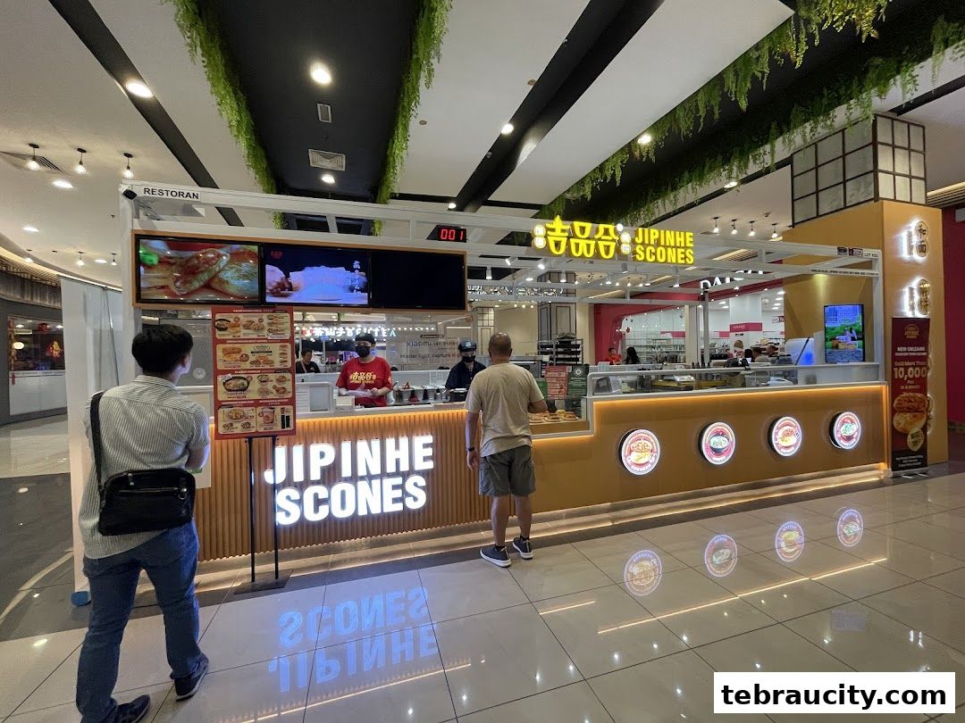 A Jipinhe Scones shop front with customers and staff visible.