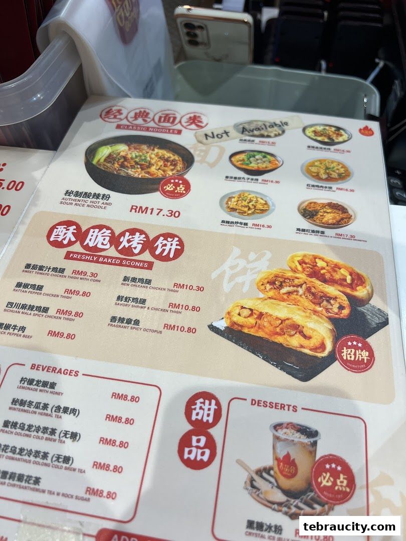 A menu from Jipinhe Scones Malaysia featuring classic noodles, freshly baked scones, beverages, and desserts.