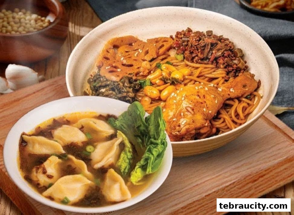 A bowl of noodles with chicken and a side of dumplings in broth.