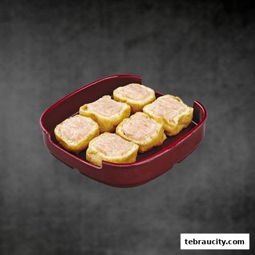 A red tray holds six pieces of fried tofu stuffed with minced meat.