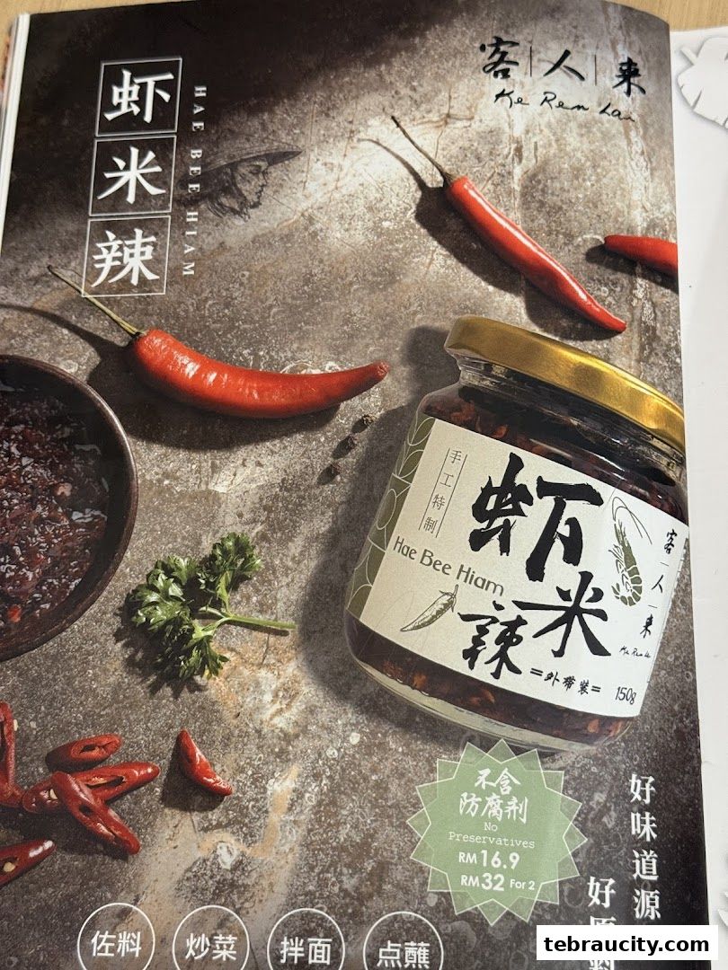 A jar of Hae Bee Hiam with chili peppers and ingredients, promoting a product.