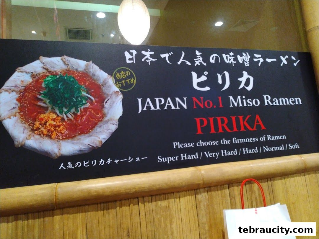 A sign advertising Japan's No.1 Miso Ramen, Pirika, with an image of the dish.
