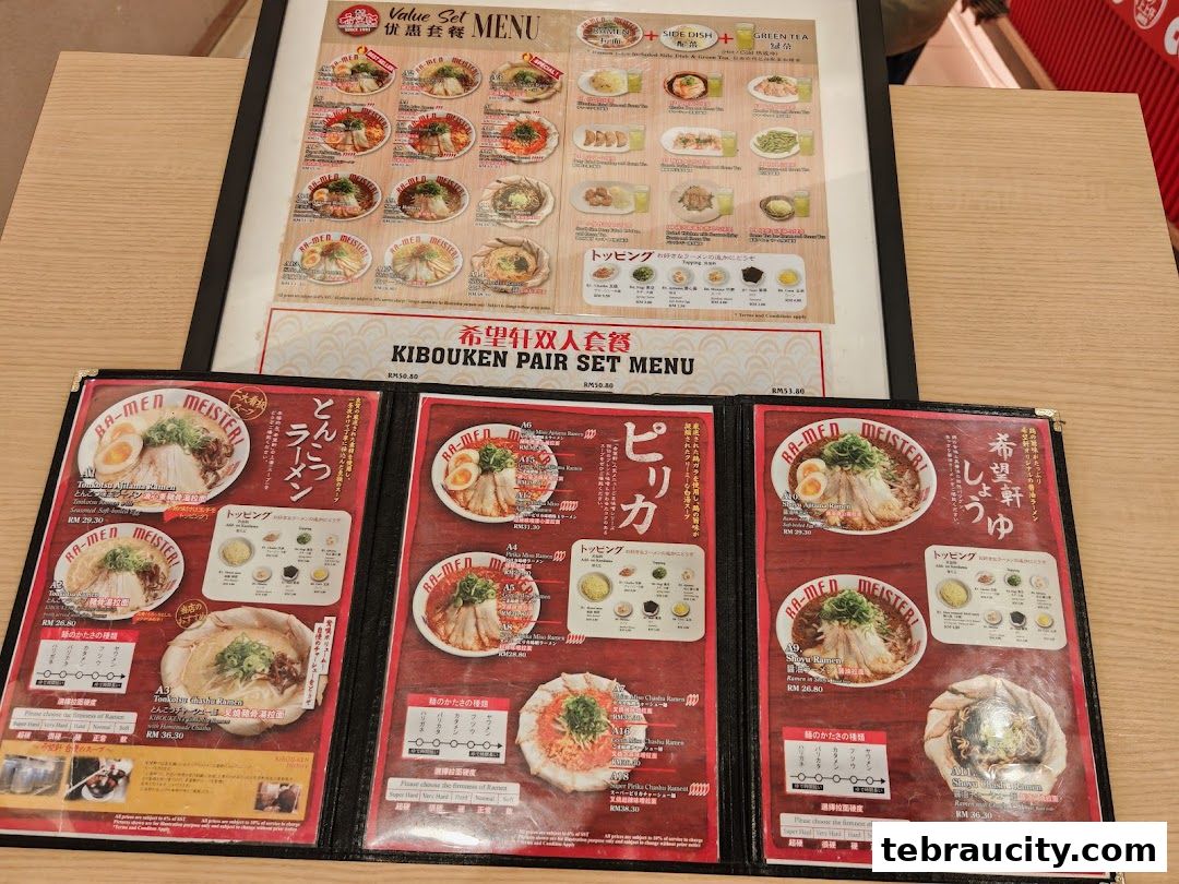 A close-up view of a ramen restaurant's menu featuring various ramen dishes and set menus.