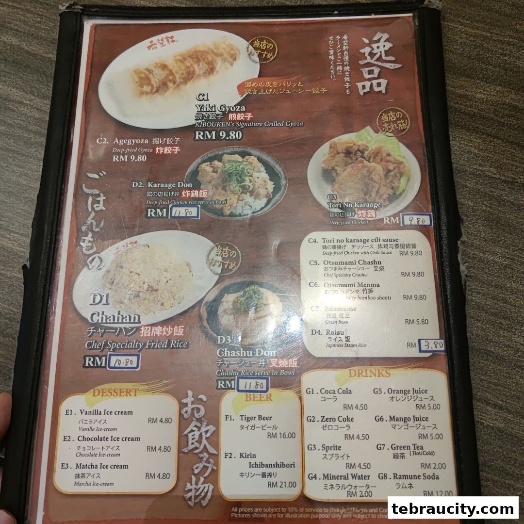 A menu from Kibou-ken featuring Japanese dishes like gyoza, fried chicken, and rice bowls, plus desserts and drinks.