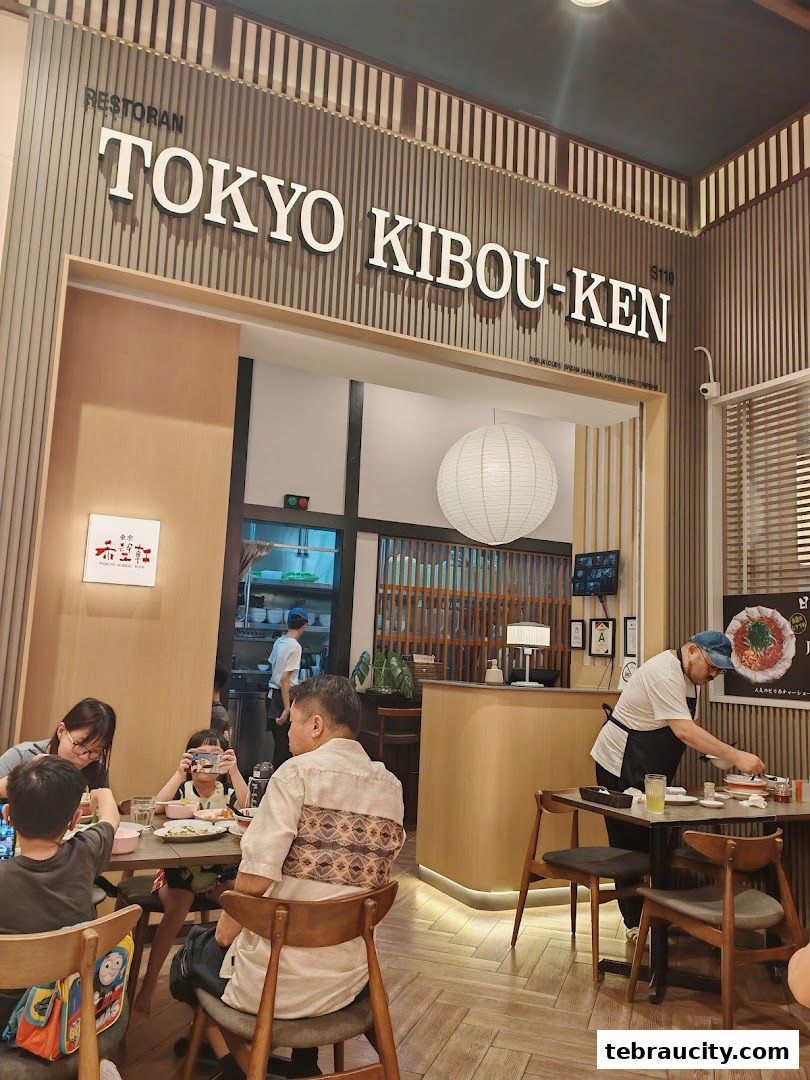 A family dines at Tokyo Kibou-Ken, a Japanese restaurant with a modern interior.