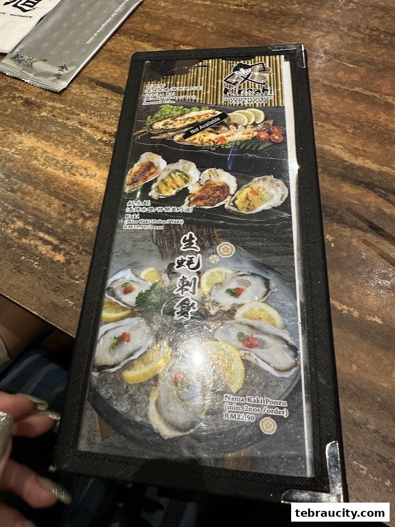 A menu from Kinsahi Japanese Restaurant featuring grilled fish and oysters.
