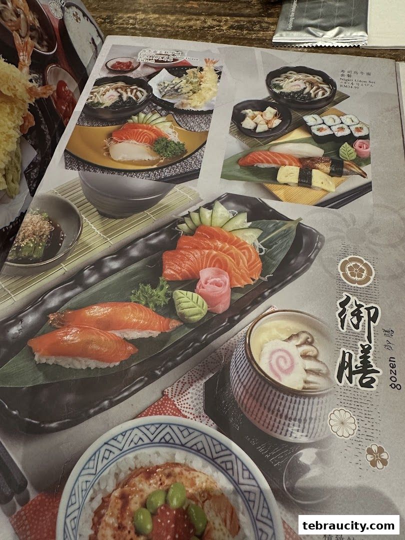 A menu showcasing various Japanese dishes including sushi, sashimi, and udon.